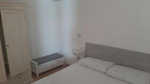 Postel nebo postele na pokoji v ubytování Appartamento Residence Mirice Vignola mare Aglientu casa Mattia