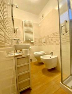 a bathroom with a sink and a toilet and a shower at hotel lisà in Viareggio