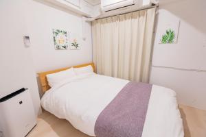 Katil atau katil-katil dalam bilik di Feel Asakusa Stay