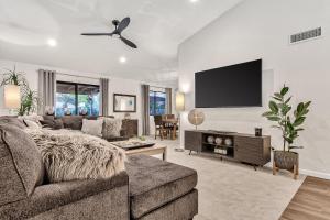 a living room with a couch and a flat screen tv at Sunset Ridge in Phoenix