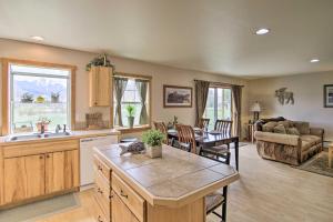 a kitchen and living room with a couch and a table at Airy Emigrant Townhome with Sweeping Mtn Views! in Emigrant