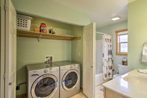 a bathroom with a washing machine and a sink at Airy Emigrant Townhome with Sweeping Mtn Views! in Emigrant
