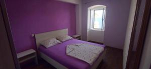 Postel nebo postele na pokoji v ubytování Apartments Mladenka
