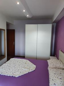 Postel nebo postele na pokoji v ubytování Apartments Mladenka