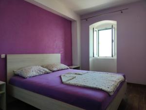 Postel nebo postele na pokoji v ubytování Apartments Mladenka