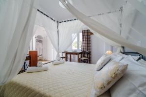 Кровать или кровати в номере Stavros Villas