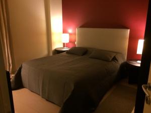 En eller flere senge i et værelse på Suite Artemisia