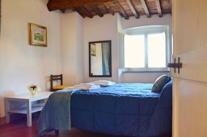 Ένα ή περισσότερα κρεβάτια σε δωμάτιο στο Casa "IL BRIO"