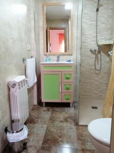 a bathroom with a sink and a shower at Alojamiento Rural in Tobarra