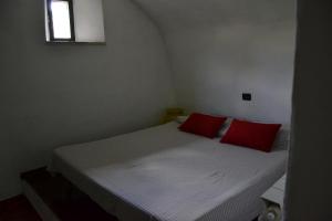 A bed or beds in a room at La Rocchetta