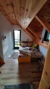 a room with two bunk beds in the attic at Apartments Durmitor in Žabljak
