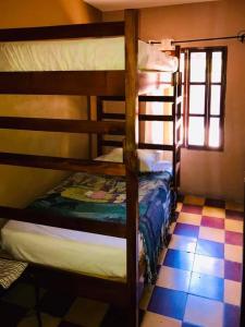 Rúm í herbergi á HOTEL EL ALMENDRO