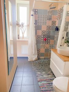 a bathroom with a shower and a toilet at Kolka in Kolka