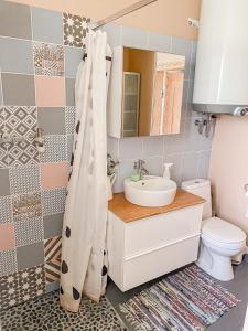 a bathroom with a sink and a toilet at Kolka in Kolka