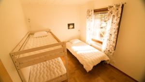 Ένα ή περισσότερα κρεβάτια σε δωμάτιο στο Camp Alta Kiruna