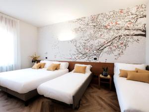 Postel nebo postele na pokoji v ubytování Hotel Lory