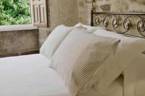 A bed or beds in a room at Sete Artes by Como en Casa