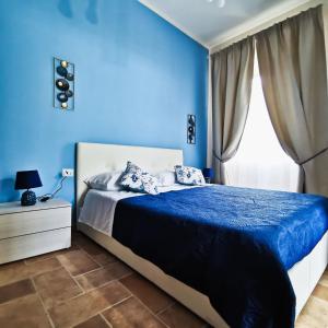 Un pat sau paturi într-o cameră la Il Sentiero di Leano