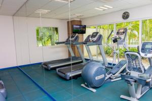 a gym with treadmills and elliptical machines at Holiday Inn Acapulco La Isla, an IHG Hotel in Acapulco