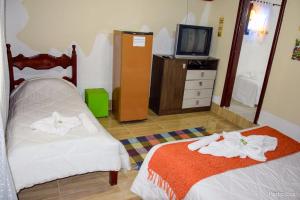 Uma cama ou camas num quarto em Pousada das Acerolas