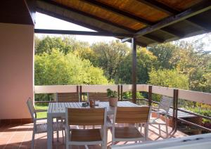a patio with a table and chairs on a deck at Ljupka in Graberje Ivanićko