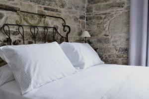 A bed or beds in a room at Sete Artes by Como en Casa