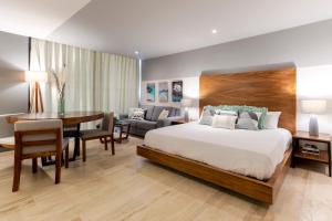 En eller flere senge i et værelse på MAGNÍFICO ESTUDIO CON ROOFTOP CERCA DE 5TA AVENIDA + 19 billeder