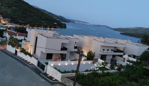 an aerial view of a house with a lake at Darijan Apartments in Marina