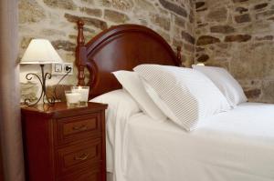 A bed or beds in a room at Sete Artes by Como en Casa