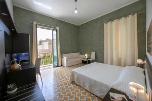 A bed or beds in a room at Terrazze Villanova