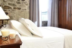 A bed or beds in a room at Sete Artes by Como en Casa