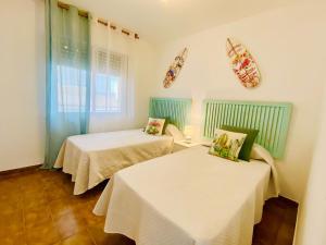A bed or beds in a room at Dora Prado Mar II