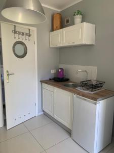 Kuchyň nebo kuchyňský kout v ubytování Domki i Apartamenty El-Piero
