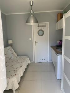 Postel nebo postele na pokoji v ubytování Domki i Apartamenty El-Piero