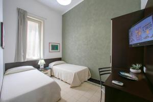 A bed or beds in a room at Terrazze Villanova