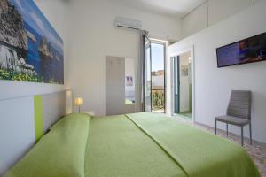 A bed or beds in a room at Terrazze Villanova