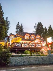 a large house with a painting on the front of it at Arrowhead Lake Inn in Lake Arrowhead