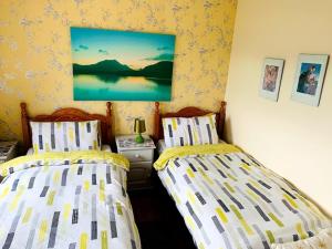 Postel nebo postele na pokoji v ubytování Lakeview House B&B