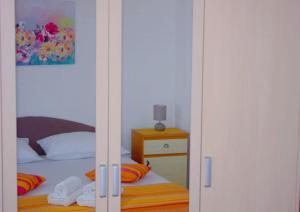 Postel nebo postele na pokoji v ubytování Apartment Ema