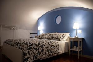 Postel nebo postele na pokoji v ubytování I Sassi Di Teopista
