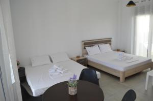 Posteľ alebo postele v izbe v ubytovaní Erika Boutique Apartments
