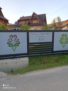 a sign that is on the side of a road at Pokoje u Sarnowskich in Kościelisko