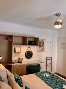 a living room with a couch and a kitchen at Cannes City B&B in Cannes