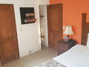 Katil atau katil-katil dalam bilik di Hotel Revi Inn