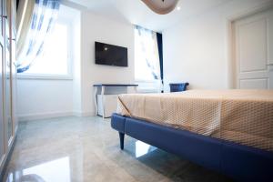 TV a/nebo společenská místnost v ubytování Cavalieri D'Oro Luxury House