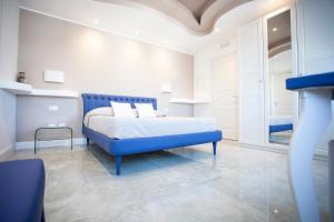 Postel nebo postele na pokoji v ubytování Cavalieri D'Oro Luxury House