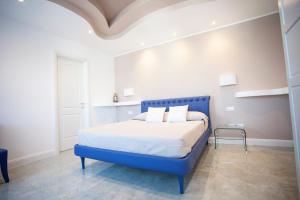 Postel nebo postele na pokoji v ubytování Cavalieri D'Oro Luxury House