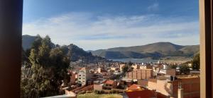 a view of a city with mountains in the background at Suma Uta in Copacabana