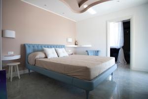 Posteľ alebo postele v izbe v ubytovaní Cavalieri D'Oro Luxury House