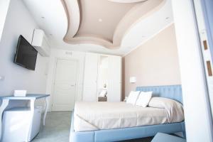 Postel nebo postele na pokoji v ubytování Cavalieri D'Oro Luxury House